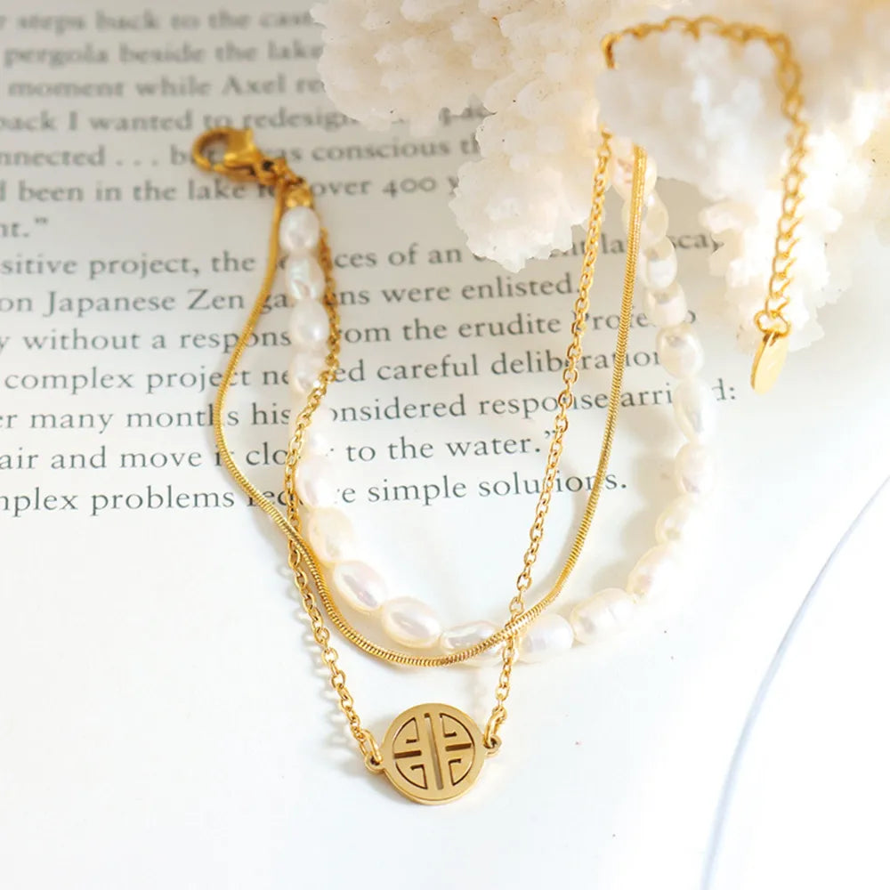 Titaniumstalen Drie-Laags Parelarmband – Elegant & Duurzaam